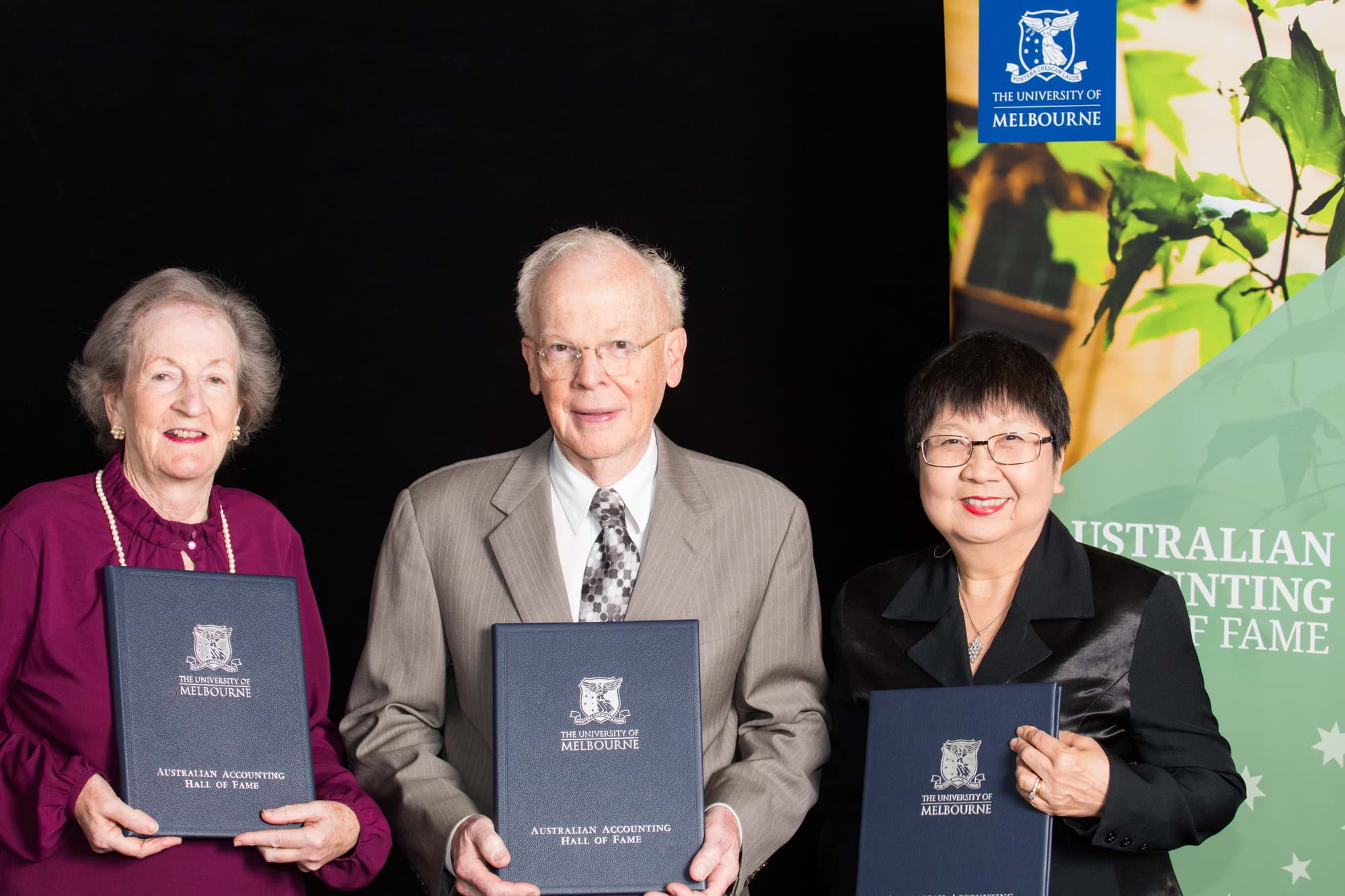 Corporate Event Photography | Melbourne Photography | Close up of business man and women with awards
