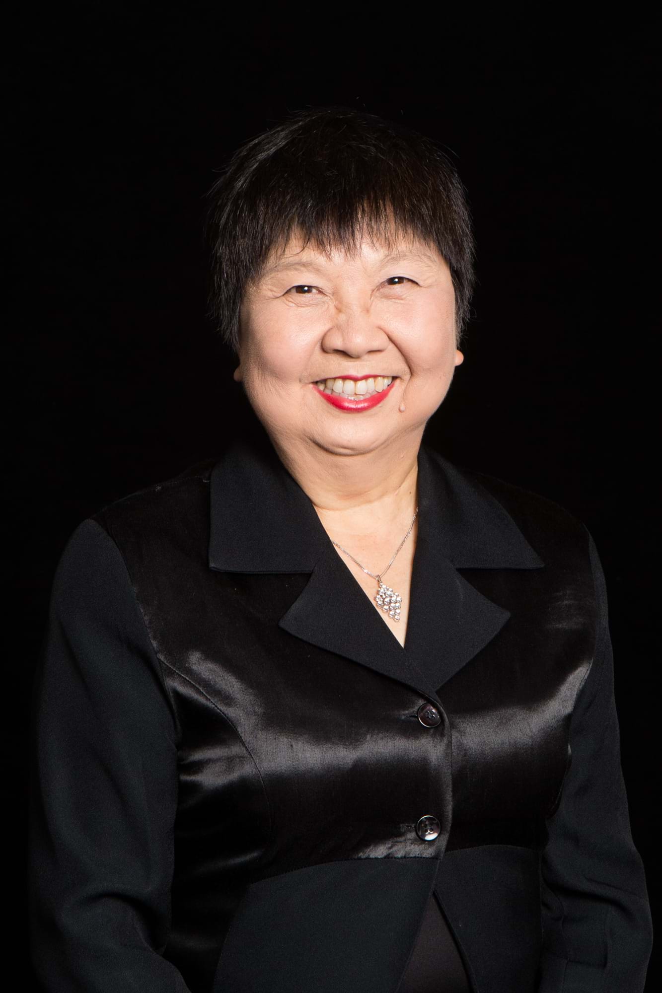 Corporate Portrait Photography | Melbourne Photography | Individual head and shoulder corporate photo of woman on black background