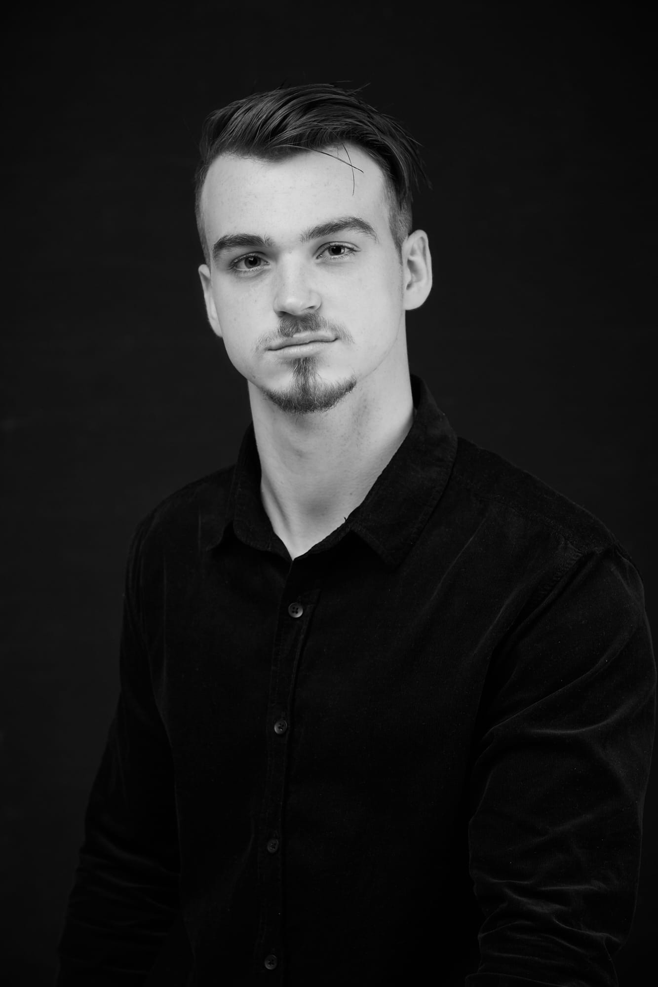 Corporate Portrait Photography | Melbourne Photography | Individual head and shoulder corporate photo of man black and white image on black background