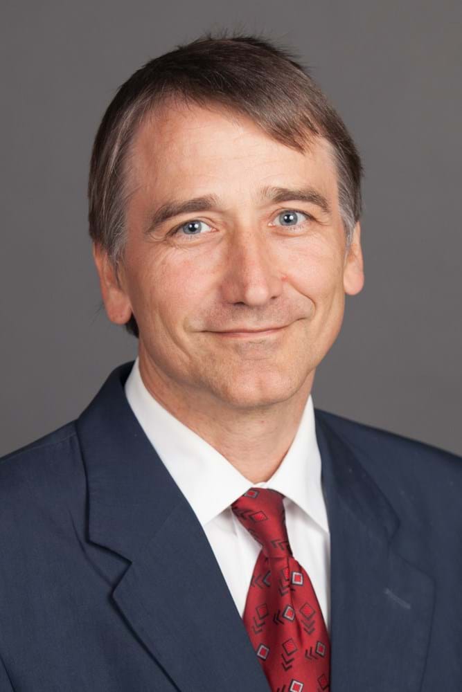 Corporate Portrait Photography | Melbourne Photography | Individual head and shoulders corporate portrait of man on grey background